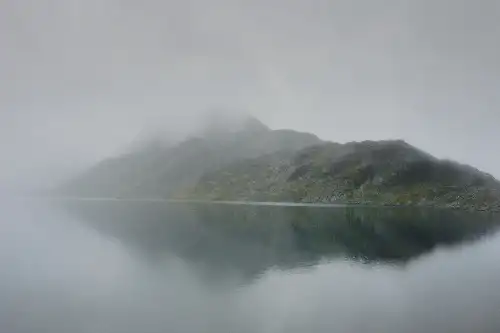 photo containing: Water, Mountainous landforms, atmospheric phenomenon, Mountain, Fog, Highland, Mist, Wilderness, Lake, Mountain range