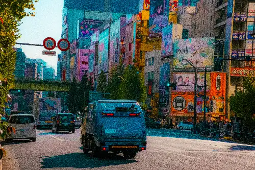 photo containing: Mode of transport, Motor vehicle, City, Urban area, Road, Street, Metropolitan area, Town, Car, Asphalt