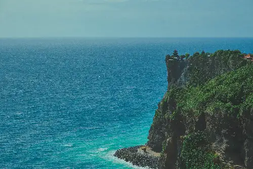 photo containing: Blue, Water, Body of water, Rock, Coast, Coastal and oceanic landforms, Sea, Terrain, Natural landscape, Cliff