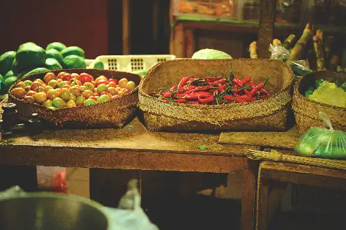 photo containing: Natural foods, Produce, Ingredient, Basket, Food, Chile de árbol, Market, Food group, Vegetable, Fruit
