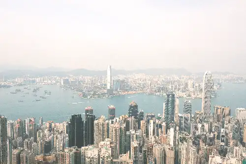 photo containing: Skyscraper, City, Urban area, Daytime, Building, Metropolitan area, Body of water, High-rise building, Cityscape, Horizon