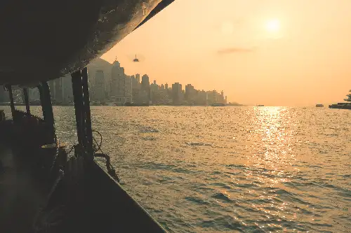 photo containing: Horizon, Boat, Waterway, Watercraft, Skyscraper, High-rise building, Dusk, Liquid, Sea, Sunset