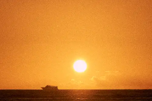 photo containing: Sun, Horizon, Yellow, Orange, Sunset, Afterglow, Fluid, Astronomical object, Dusk, atmospheric phenomenon, boat, ocean