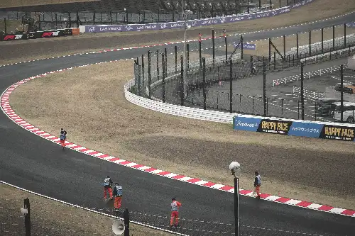 photo containing: Sports venue, Race track, Auto racing, Motorsport, Racing, Sports, Sports car racing, Race car, Fence, Tar