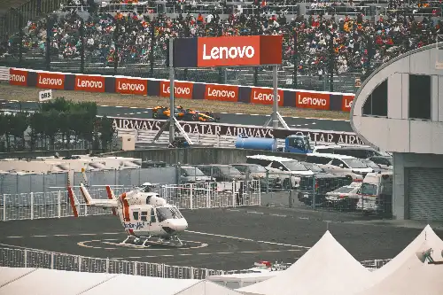 photo containing: Sports venue, Aerospace Engineering, Transport hub, Race track, Advertising, Aircraft