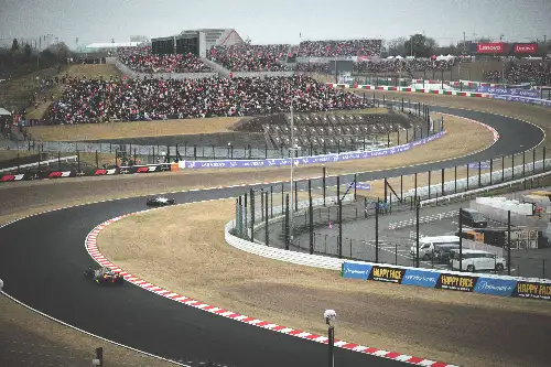 photo containing: Sports venue, Race track, Auto racing, Racing, Motorsport, Sports, Fence, Race car, Sports car racing, Tar